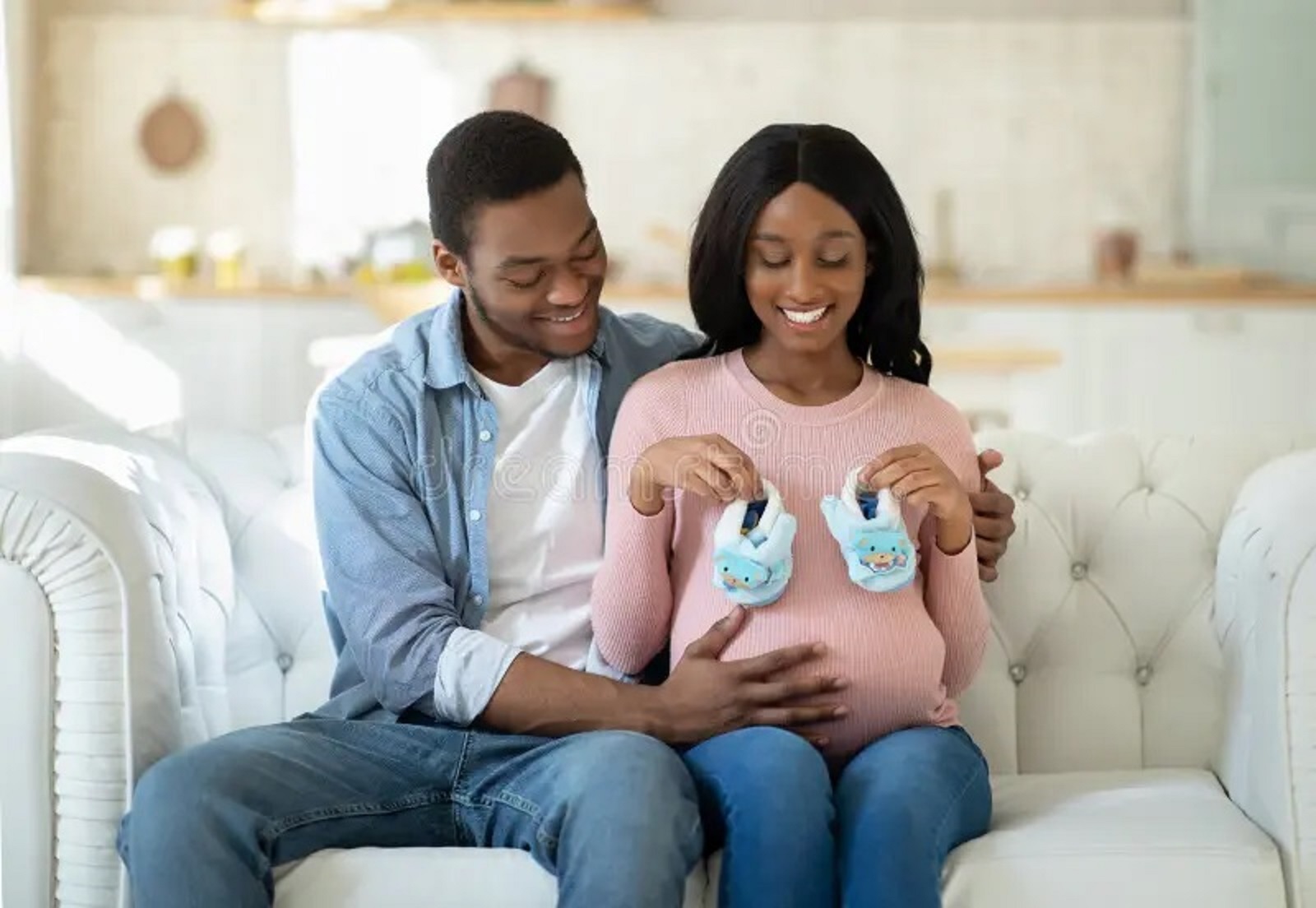 couple embracing a baby
